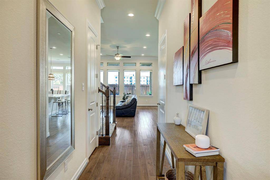 As you enter through the doors of 13215 Parkway Glen Drive, you’ll be welcomed by an exquisite entranceway that leads you seamlessly into the spacious family room.