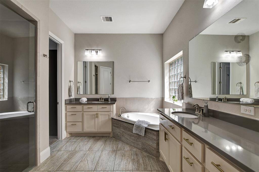TThe primary room is spacious, modern, with neutral colors and lots of natural light.