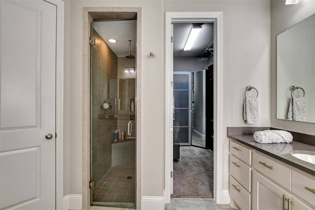To the left access to the shower and to the right access to this amazing designed walking closet.
