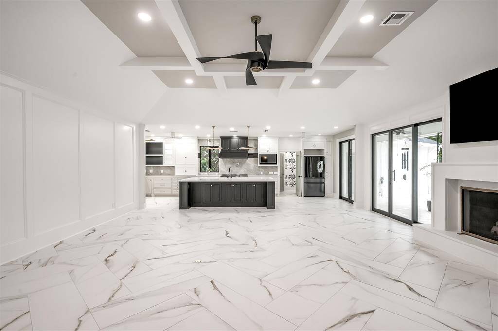 Aesthetically beautiful porcelain tile flooring laid in Herringbone pattern that makes the room look even bigger.