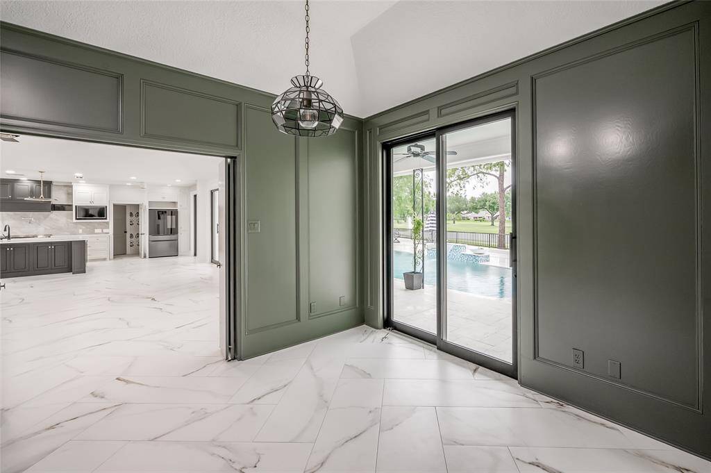 New glass sliders in the study/home office open to the patio and pool area.