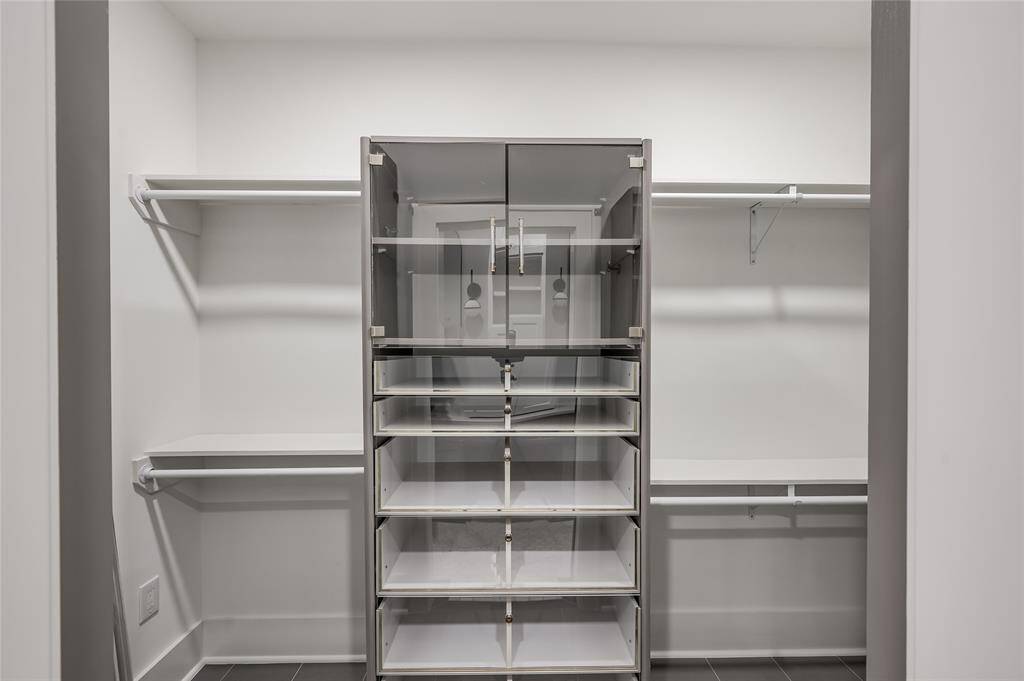 Walk-in closet with custom built-in's.