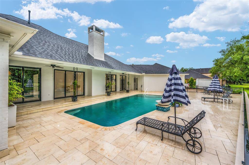 Travertine tile pool patio.