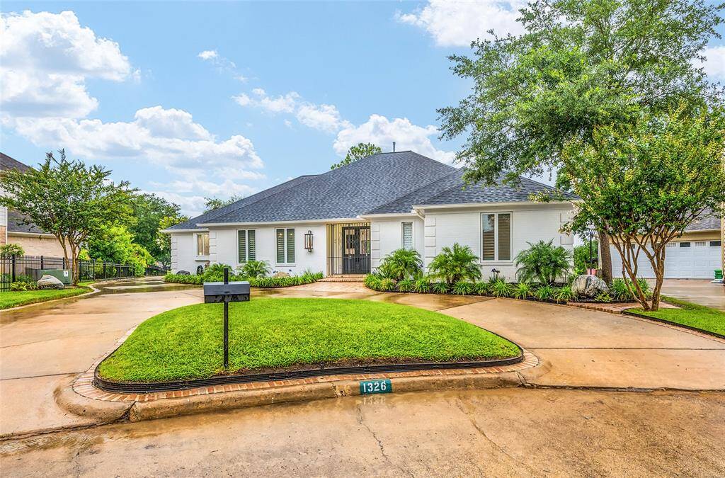 Circular driveway provides plenty of off-street parking and easy in-and-out access.