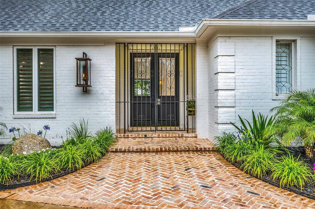Herringbone brick walkway and NEW gas wall lantern creates a welcoming entrance.