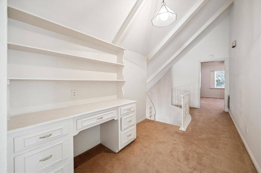 This secondary bedroom offers two separate closets, making it a practical and comfortable space,