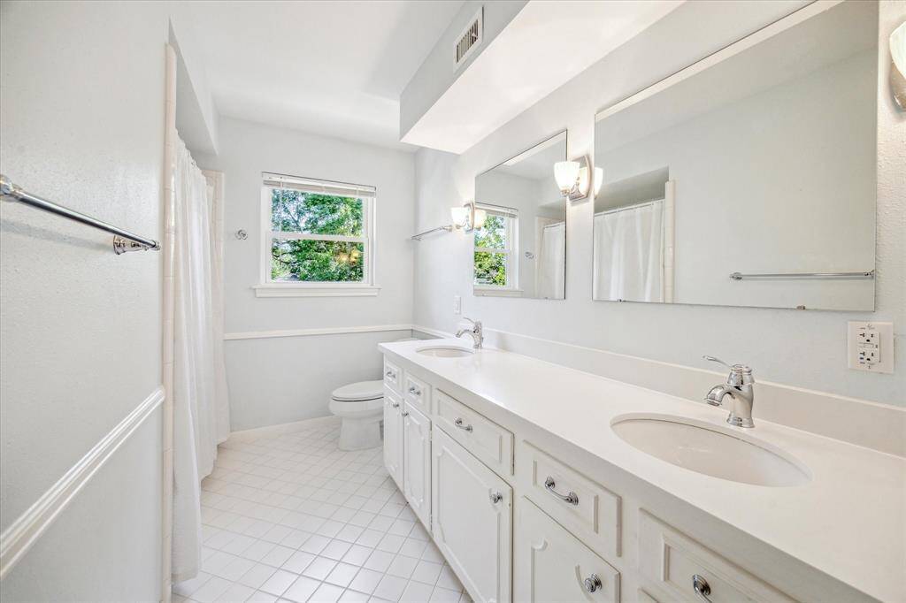 This spacious bedroom is the largest of the three and features a generous closet, making it perfect for either entertaining or comfortable living.