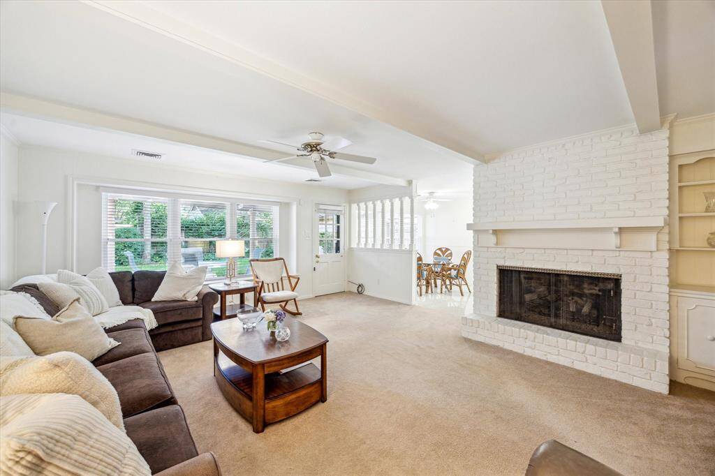 Stepping into this large family room, the first thing you will notice is the warm and inviting atmosphere complete with a gas log fireplace. The cabinets offer a blend of closed storage for items that need to be hidden away, as well as open shelves for displaying decorative items or personal collections.