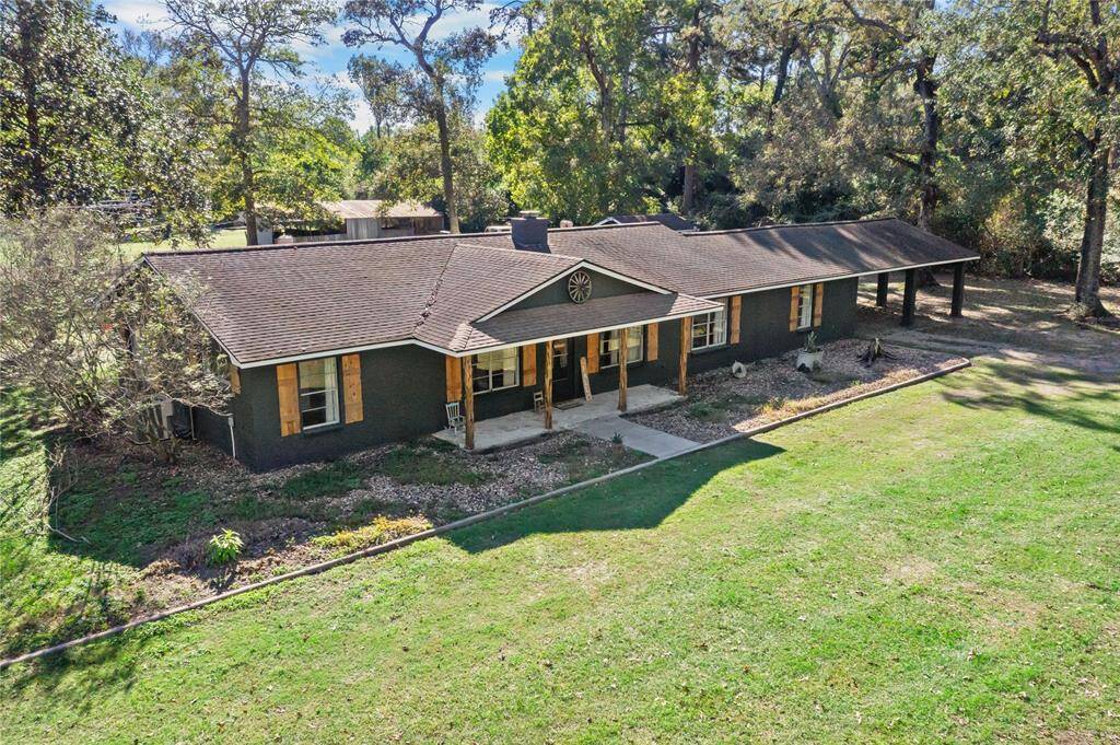 Welcome to your own private retreat — nearly 7 acres of unrestricted countryside charm just minutes from The Woodlands.