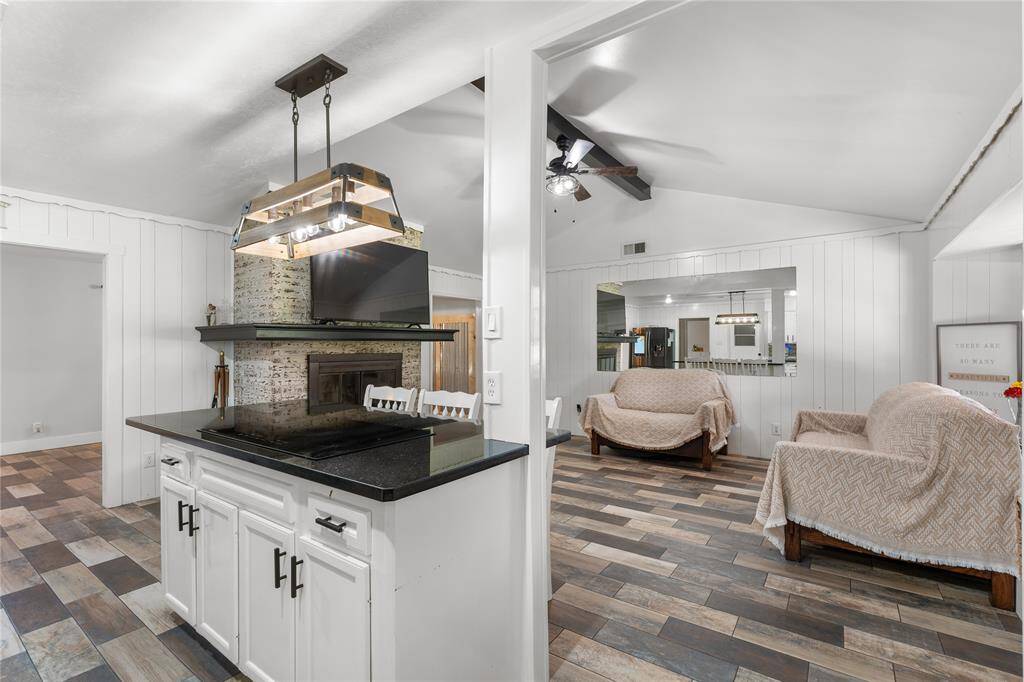Bright and functional! Updated quartz countertops, white cabinetry, and a large center island make this kitchen both stylish and practical.
