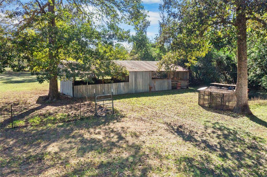 Calling all equestrians — this 4-stall horse barn is ready for your animals, hobbies, or projects.