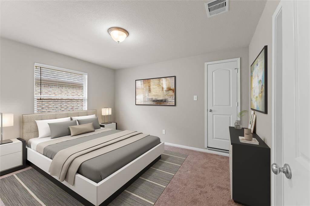 Spacious and full of light, this fourth bedroom offers plenty of room for rest and creativity.