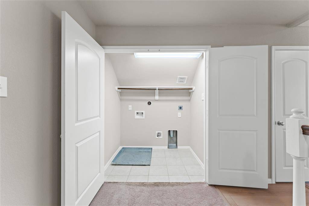 The upstairs utility room makes laundry day a breeze with easy access to all the bedrooms.