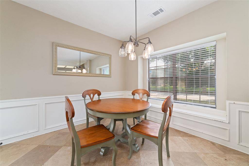 Breakfast room with door access to back covered back patio