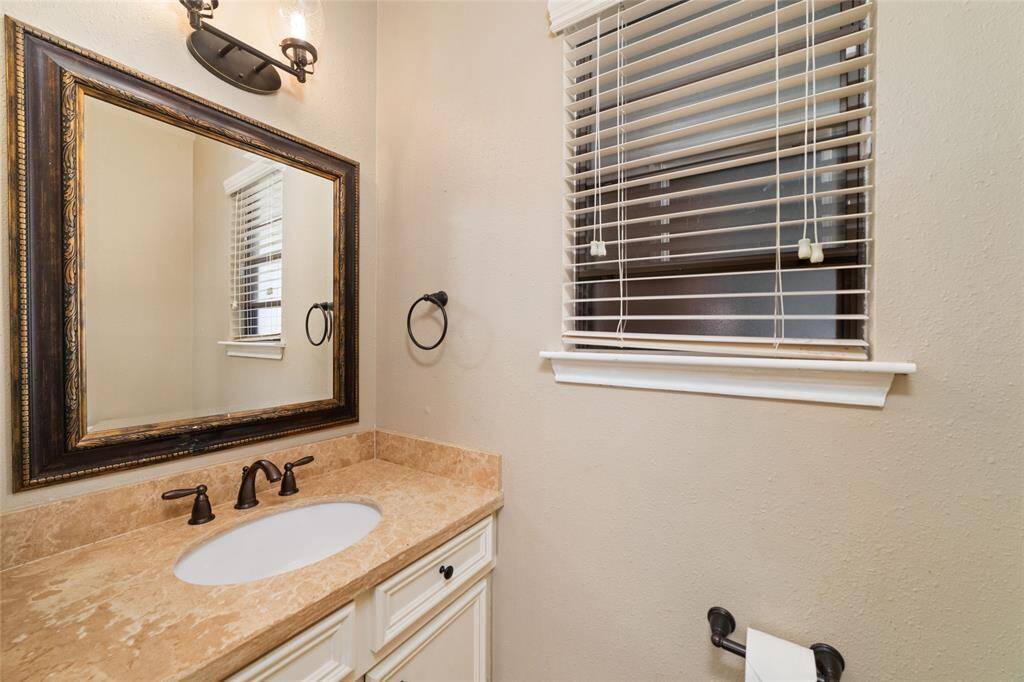Half bathroom downstairs near breakfast room