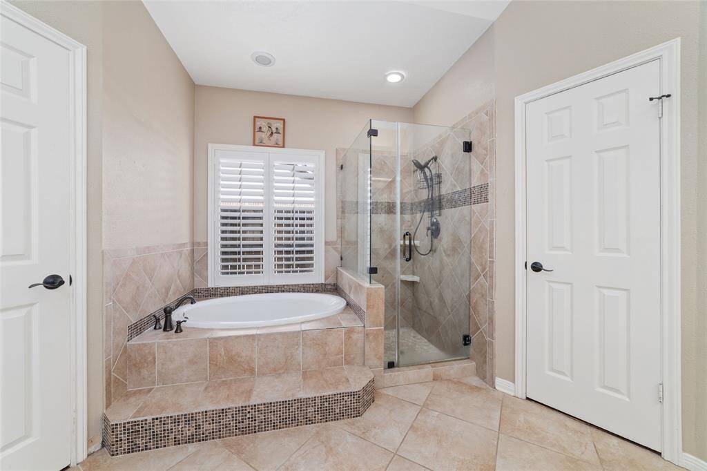 Separate tub and shower in primary bathroom