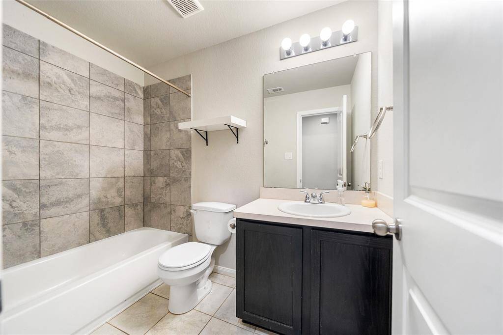 Hall bath. Notice the tile tub-surround.