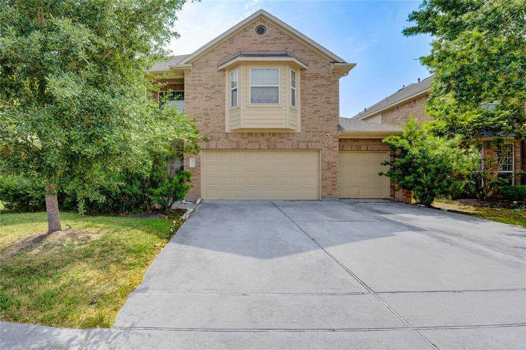 Nice front yard with 3 car garage.