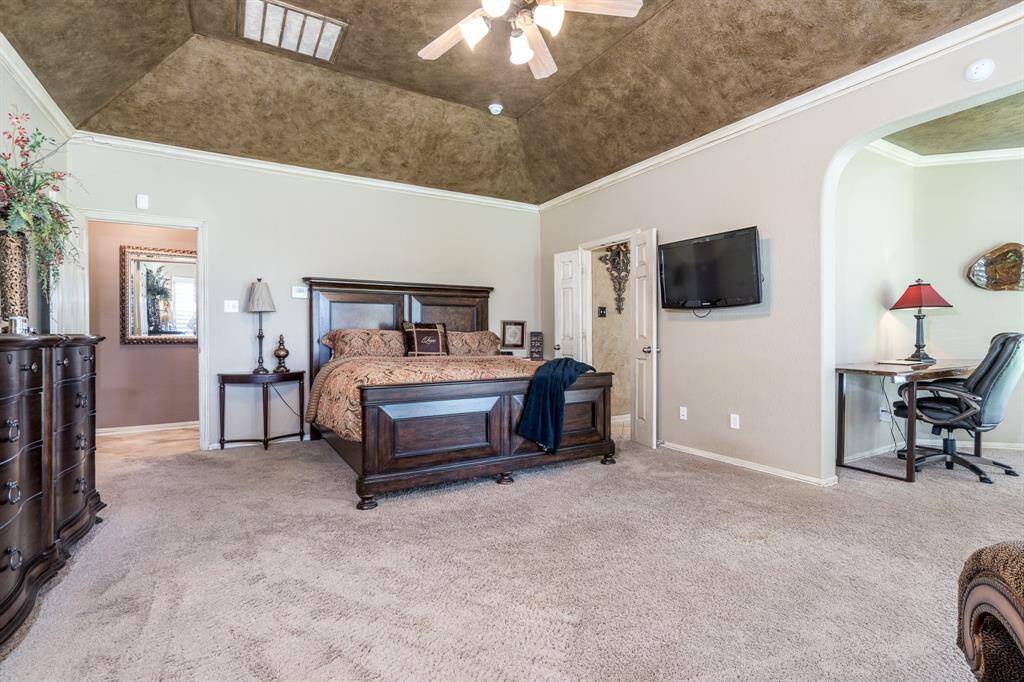 The oversized owner's suite has both a sitting area and a private office/workout room attached.