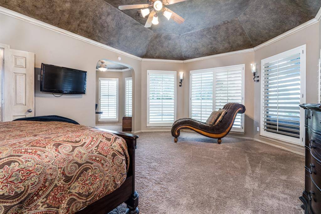 The oversized primary bedroom is your own private paradise.  With a sitting area plus a workout or additional office included.