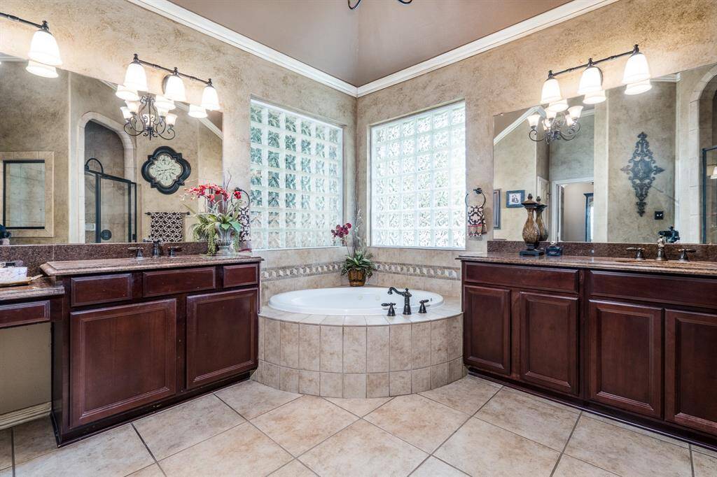 The primary bath gives you dual vanities, a garden soaking tub and makeup station.