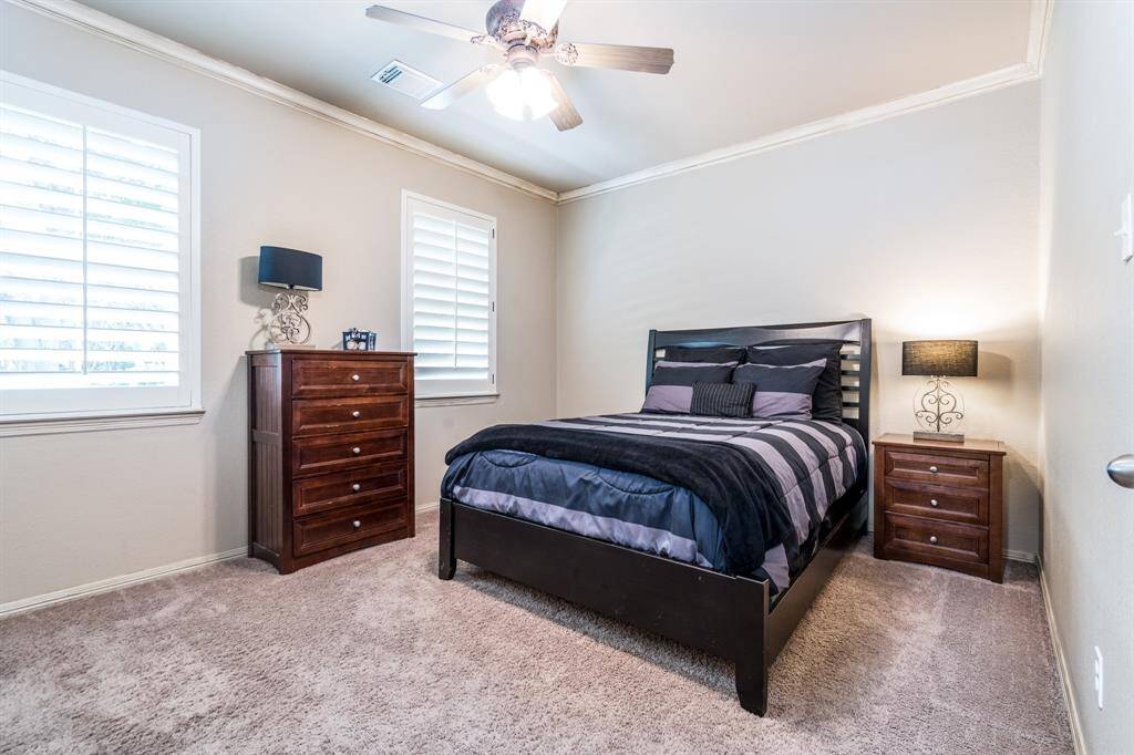 Bedroom 2 has neutral paint and carpet.