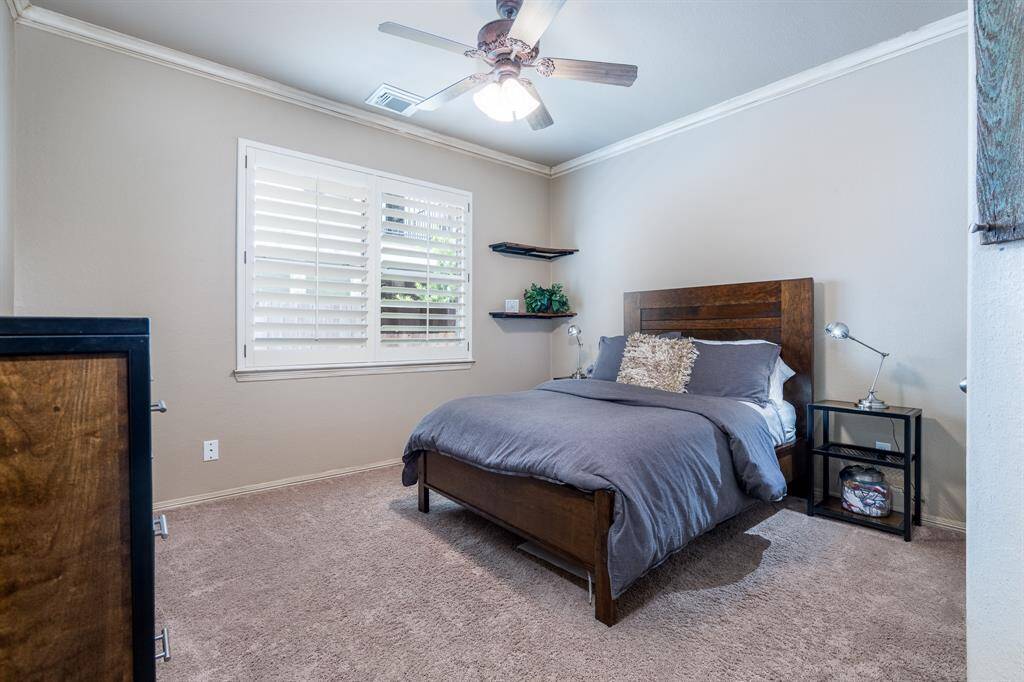 Bedroom 4 has a large closet and neutral paint and carpet.