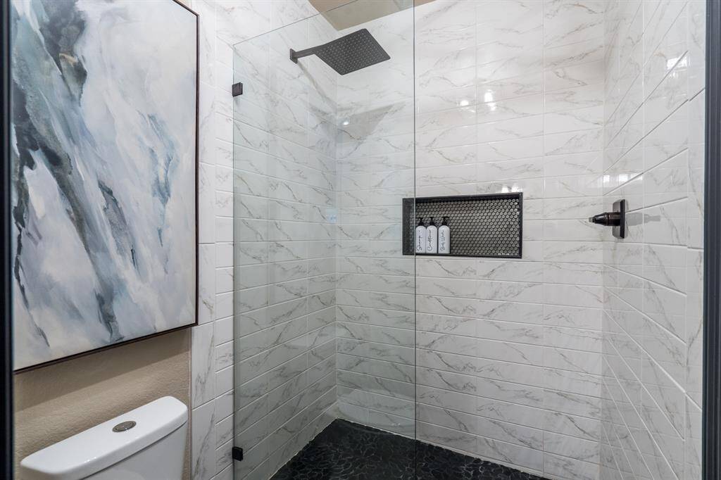The full bath, fully remodeled is across the hall from bedrooms 3 and 4.