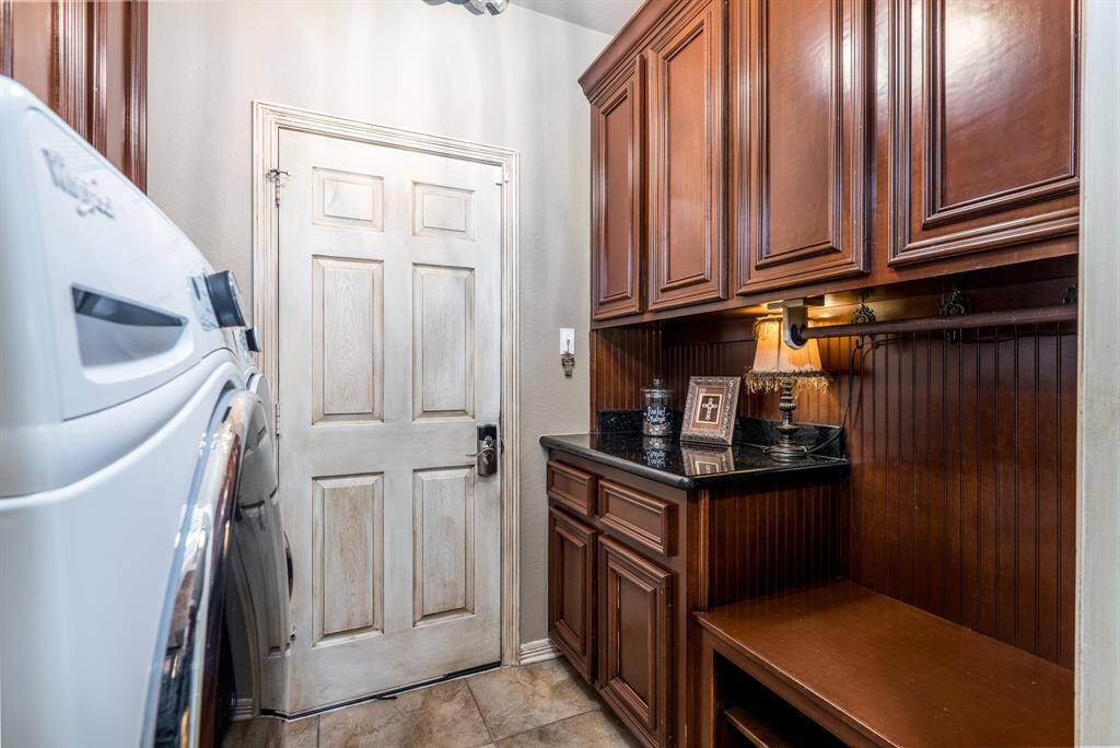 The utility room has tons of storage built in.