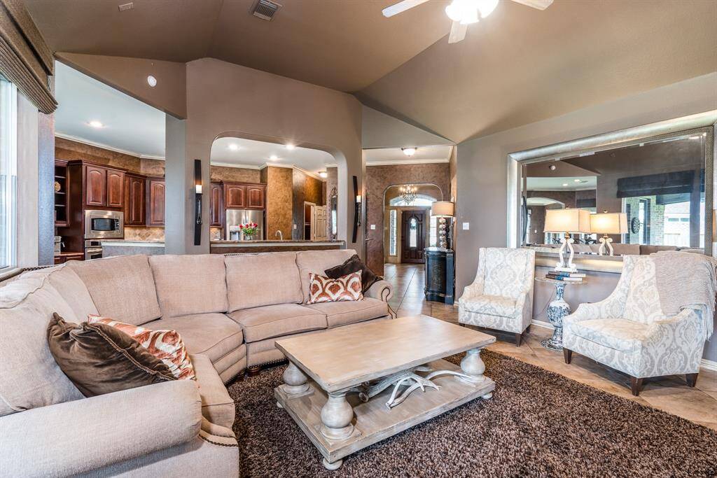 A view from the living room showing off the kitchen and entryway.