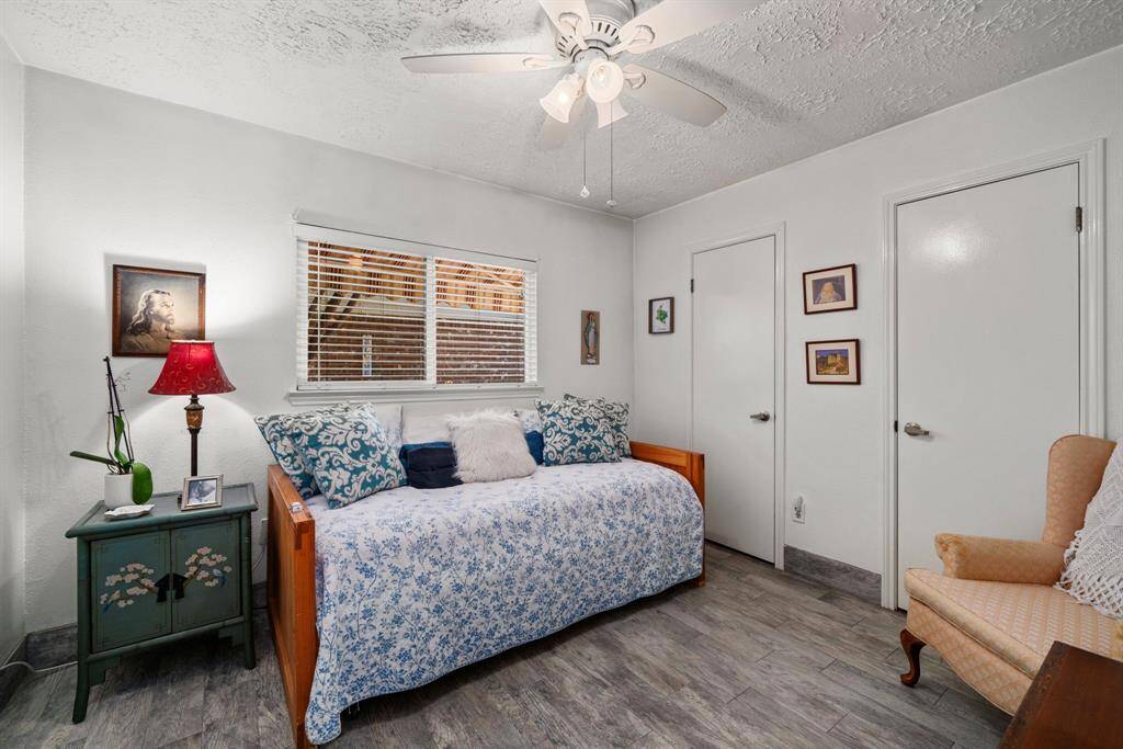 The second spacious bedroom includes two closets, ceiling fan, and tile flooring. No Carpet!