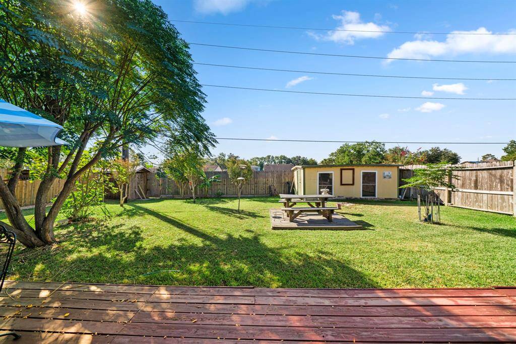 Spacious backyard includes storage sheds and offers privacy with no back neighbors, as it backs onto a green belt with a trail that leads to a large park.