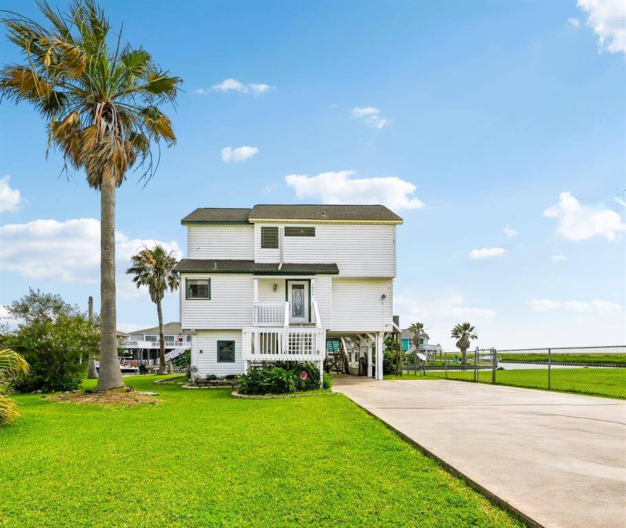 Waterfront property with a private dock, offering scenic views of a canal. Ideal for boating enthusiasts and those seeking a serene, picturesque setting.