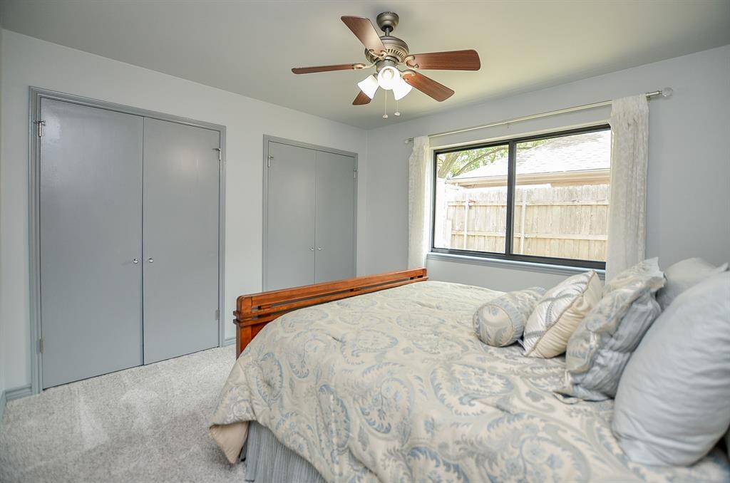 Secondary bedroom offers dual closets.
