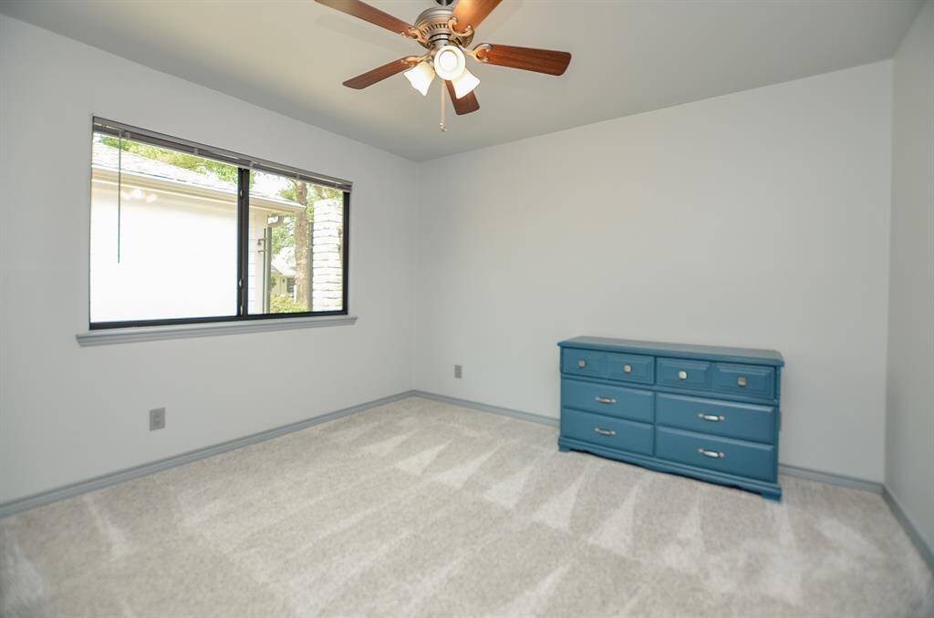 Third Bedroom stays light and bright.  All bedrooms offer new ceiling fans with light fixtures.