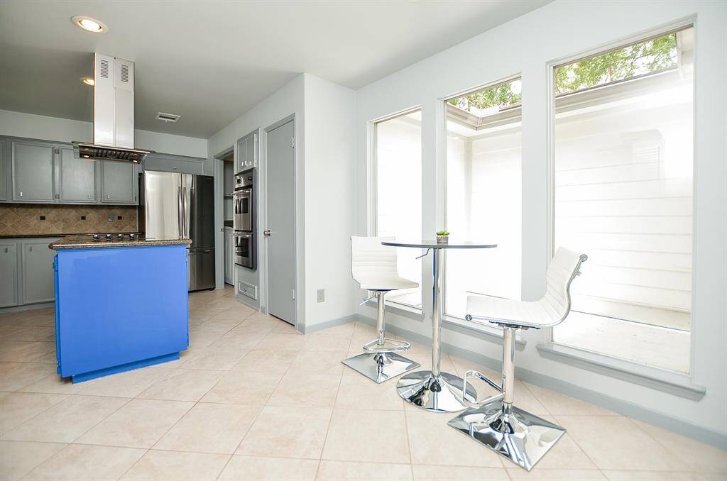 Comfy ambiance in the breakfast nook. You'll be greeted by the morning sun.