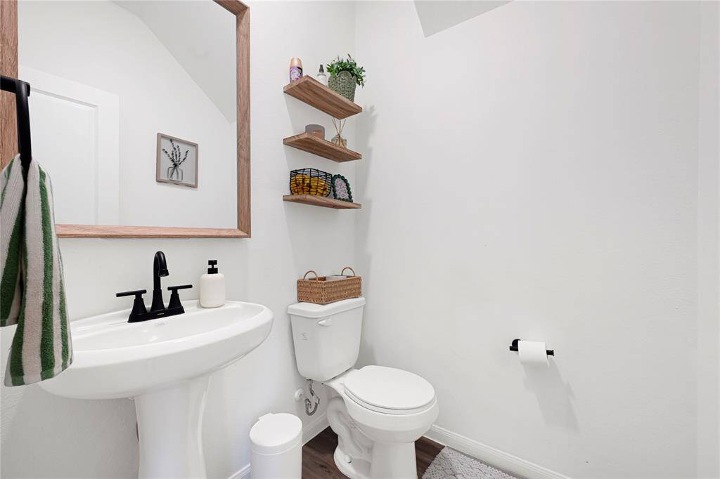 Convenient half bath located on the main floor for guests.