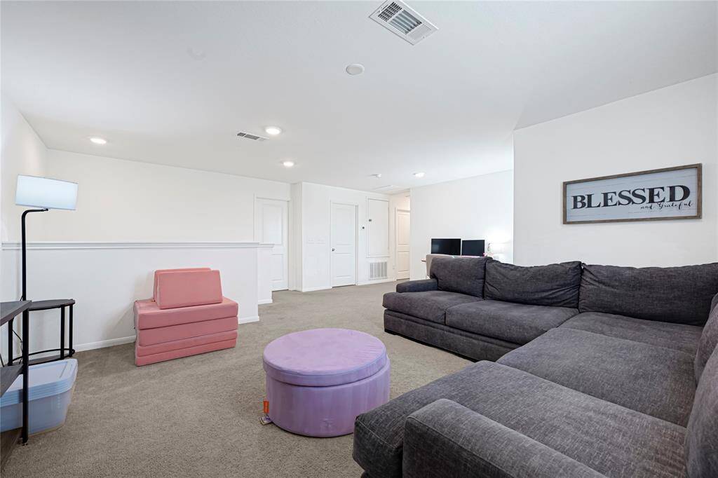 Upstairs game room provides the perfect spot for entertainment or relaxation.