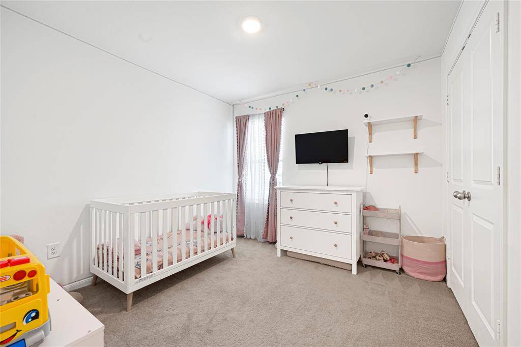 Versatile third bedroom ideal for guests, kids, or hobbies.