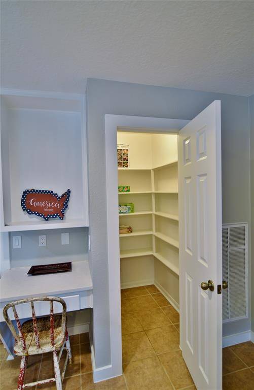 Spacious walk-in pantry, and another view of the planning desk....