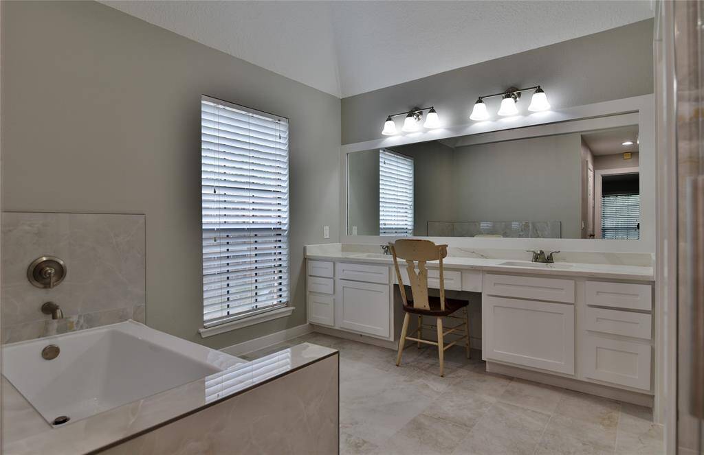 Double sinks and a vanity area with updated lighting....