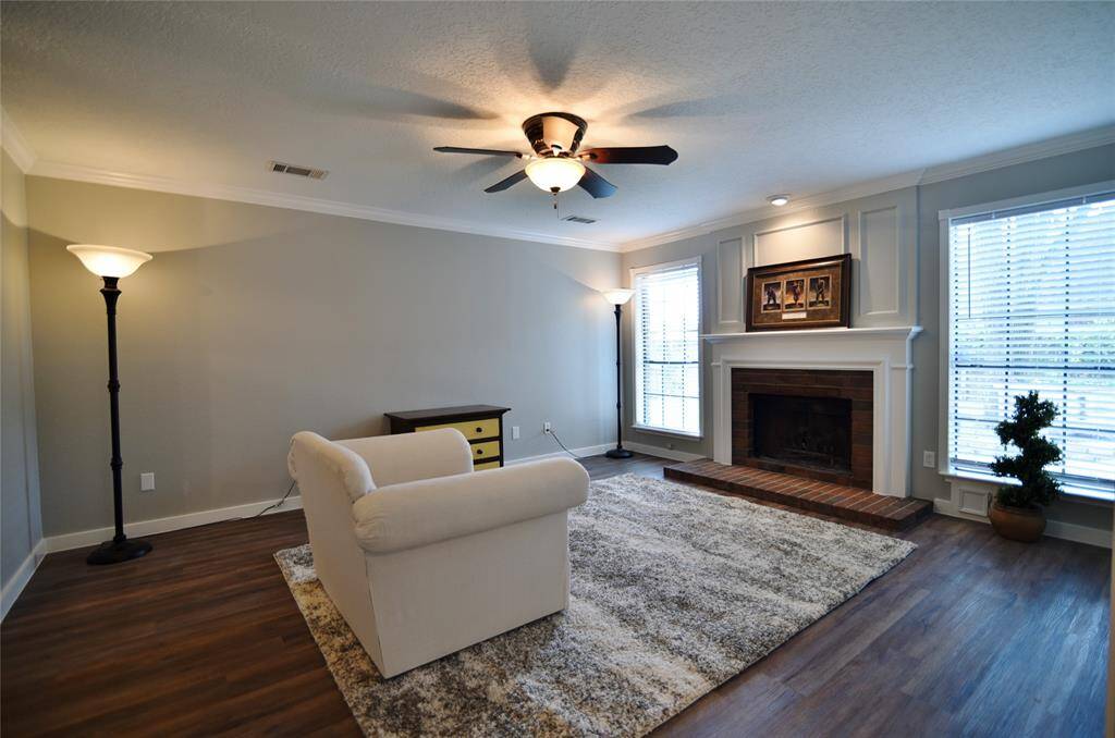 Gathering area with gas powered fireplace, lighted fan, natural light and abundant space....