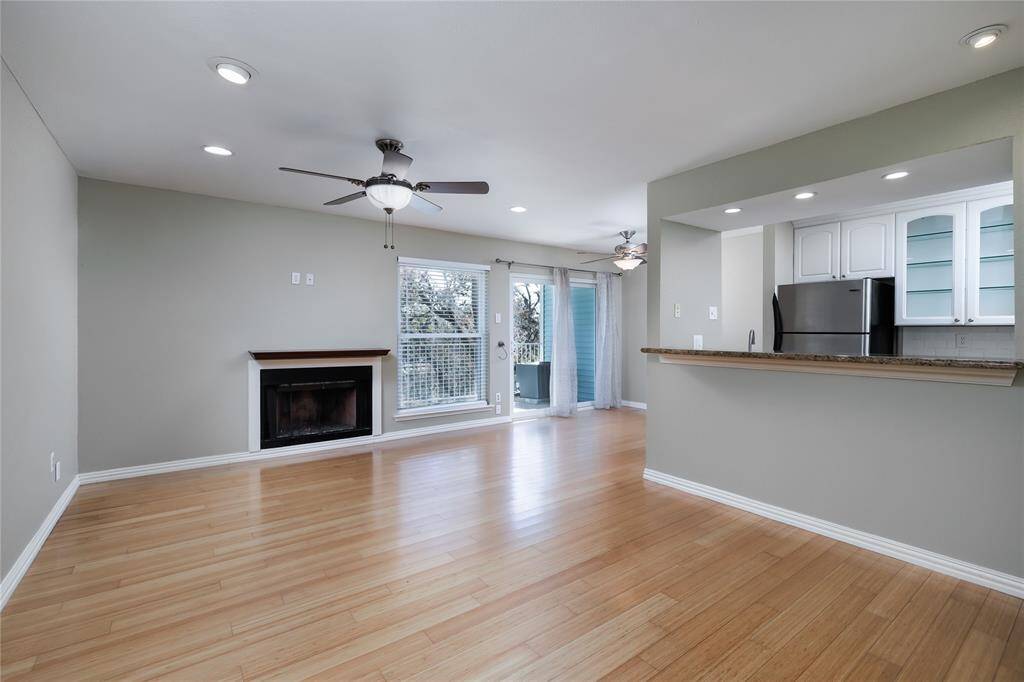 Beautiful wood flooring throughout this unit gives it flow and an elegant look.  The fireplace in the main living area is a focal point.