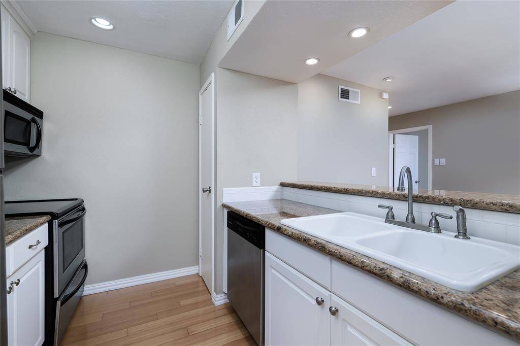 Granite countertops and double sink are some of the highlights in the kitchen.