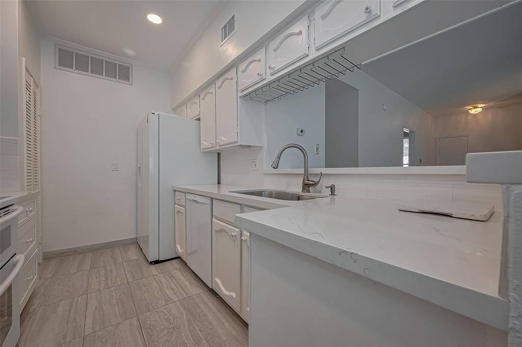 Experience the luxury of a spacious walk-in closet in the second bedroom, perfect for organizing your wardrobe and showcasing your style!