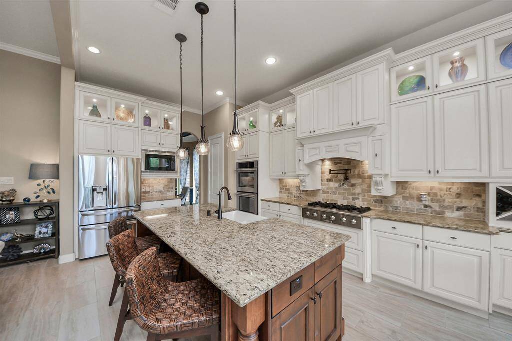 This Kitchen has it all from the Pot Filler to the Double Ovens and even a Coffee Bar!
