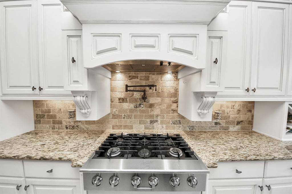 Pot Filler with 6 gas burner stove top! Don't miss the cabinet under lighting too!