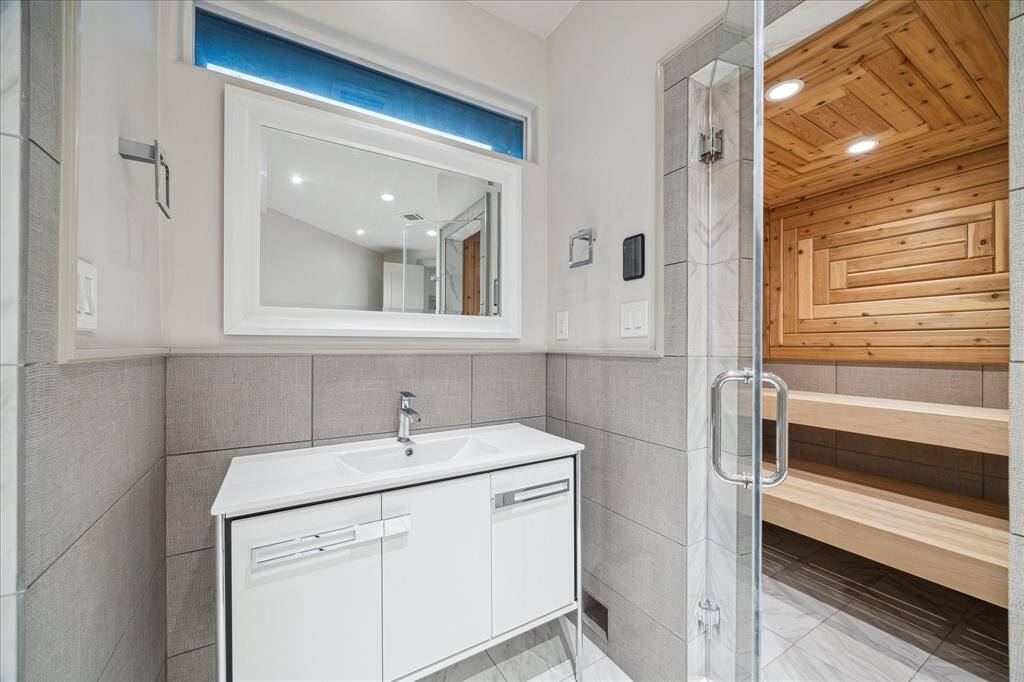 A sauna is part of the second bedroom down's full bathroom.