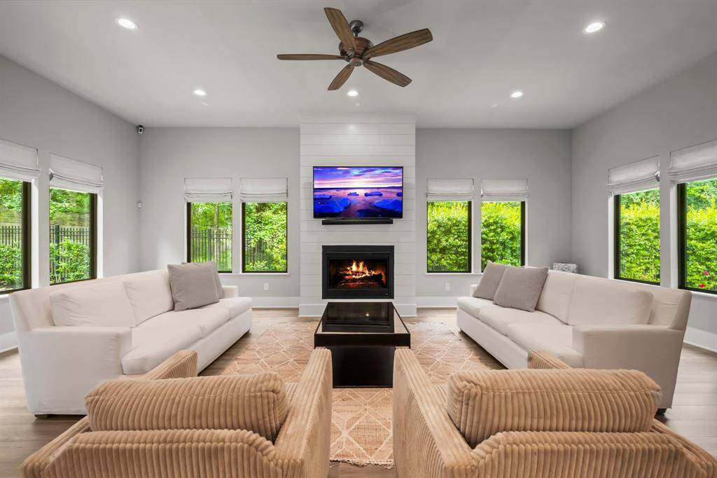 Inviting fireplace and automated shades in the family room