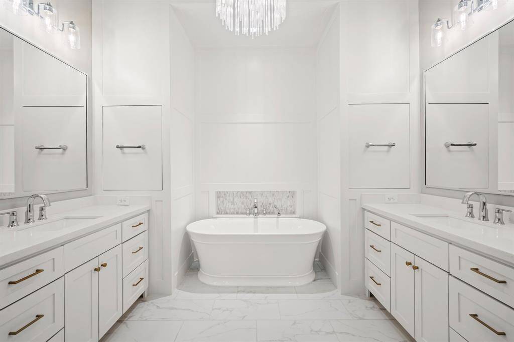 Beautiful primary bath suite hidden medicine cabinets